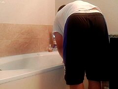 asian amateur tidies bathroom during house chores