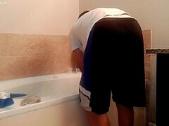 asian amateur tidies bathroom during house chores