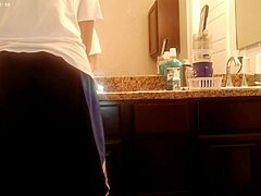asian amateur tidies bathroom during house chores