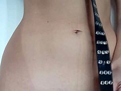 She endures light belt punishment spanking her pussy and tits