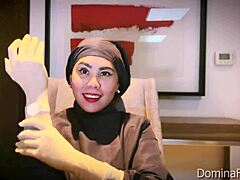 nurse slips on tight medical gloves for fetish patient play
