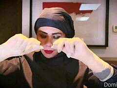 nurse slips on tight medical gloves for fetish patient play