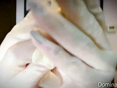 nurse slips on tight medical gloves for fetish patient play