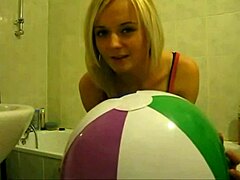 Sophie masturbates wildly with balloons in living room bathroom
