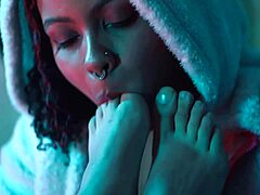 a busty latina lesbian babe caresses her girlfriend's bare feet toes and soles in intimate play moaning softly together