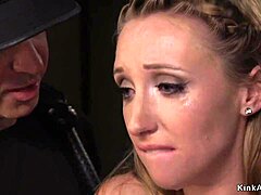 Bound brunette takes rough doggy pounding while choking on cock.