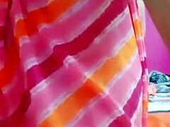 Wanna see this Indian aunty dance and flash her boobs?