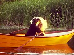 vintage couple rides rough outdoors on boat heels and stockings