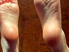 Girl smoothly applies lotion over her soft tempting feet