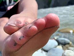 goddess teases cute nylon soles and toes riverside in tan pantyhose closeup