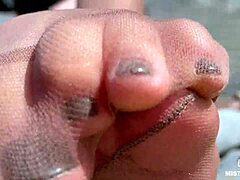 goddess teases cute nylon soles and toes riverside in tan pantyhose closeup