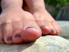 goddess teases cute nylon soles and toes riverside in tan pantyhose closeup