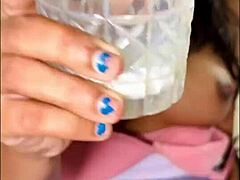 Nude housewife milks boobs onto glass dildo pussy