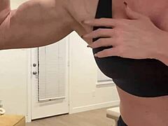Hey fans, check out this muscle babe flexing her big tits!