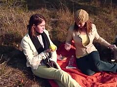 two brunette pals picnic turns into outdoor strapon lesbian pounding