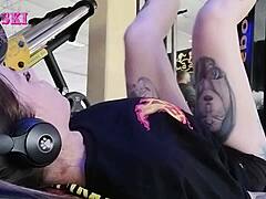 edgy tattooed young gym girl bends into sexy stretches showing off her alternative curves