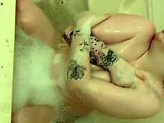 chubby oiled babe spreads big pussy lips in tub