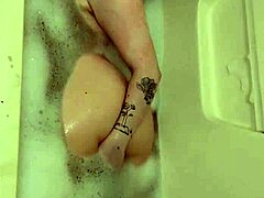 chubby oiled babe spreads big pussy lips in tub