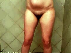 A sexy solo girl shakes her big ass seductively in the steamy shower.