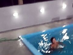 How hot is this redhead flashing nude by the pool?