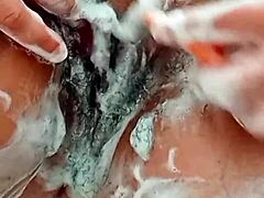 😍 Young brunette shaves hairy pussy up close! 🔥