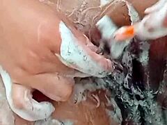 😍 Young brunette shaves hairy pussy up close! 🔥