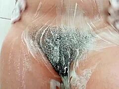 😍 Young brunette shaves hairy pussy up close! 🔥
