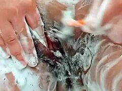 😍 Young brunette shaves hairy pussy up close! 🔥
