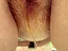 redhead with thick bush pees through hairy wet pussy lips