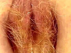 redhead with thick bush pees through hairy wet pussy lips