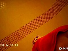 spy cam catches showering babe's nude big tits