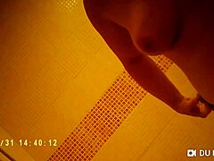 spy cam catches showering babe's nude big tits