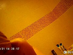 spy cam catches showering babe's nude big tits