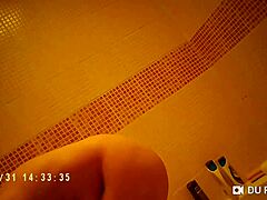 spy cam catches showering babe's nude big tits