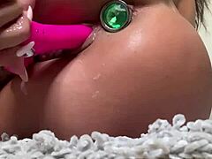 Sexy bodybuilder babe in lingerie creams body while riding dildo anal plug to orgasm