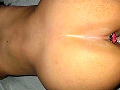 a couple bends her over for doggystyle anal with buttplug until orgasm in her ass