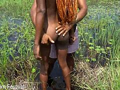 Skinny African Ebony with Narrow Ass Gives Outdoor Handjob to Tourist by River